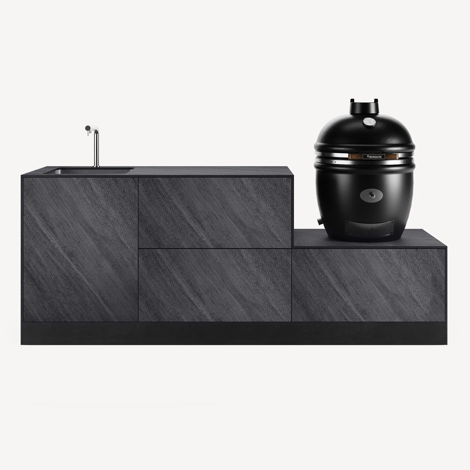 Cuisine extérieure moderne avec meuble en finition pierre sombre, évier intégré à gauche et barbecue kamado noir à droite.